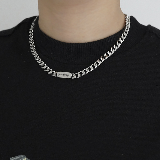 A silver-coloured, titanium steel necklace with a six-sided grinding NK chain design.