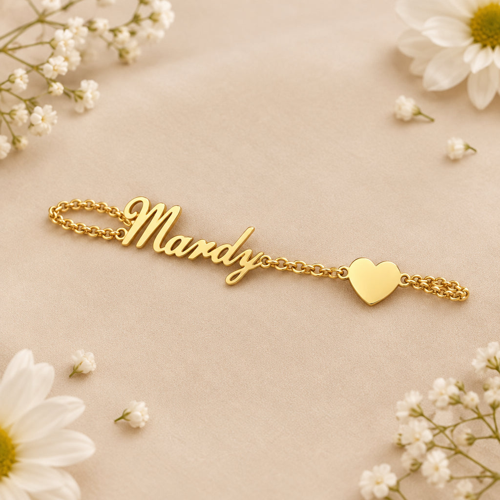 Gold bracelet with 'Mandy' on a beige background with white flowers